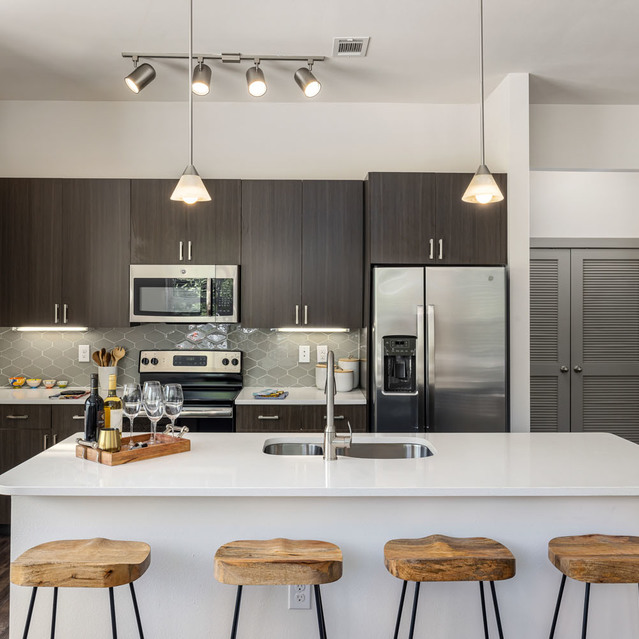 Creekside at Crabtree - Wood Stools by the Kitchen Island